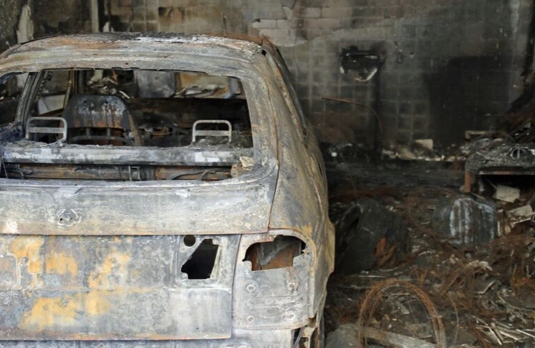 burned car in garage