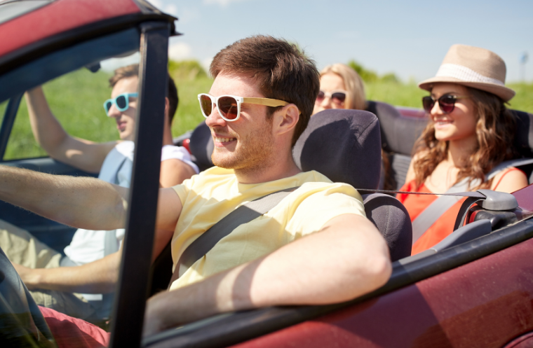 group of young adults in a car